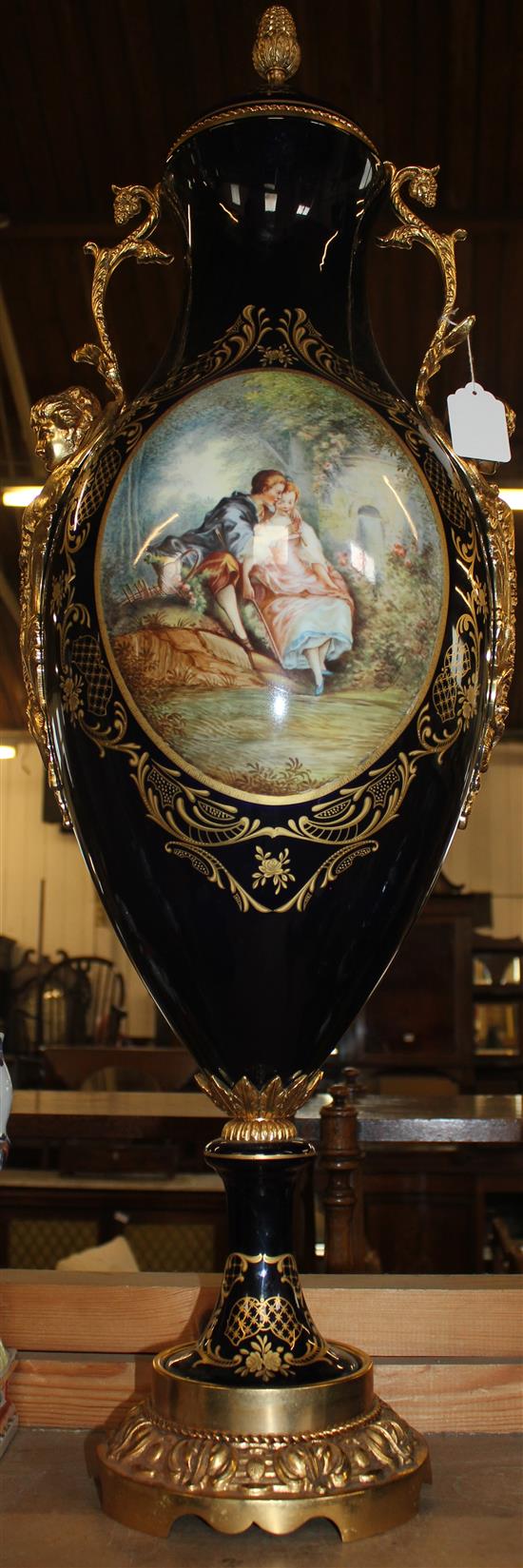 A large Sevres style porcelain and gilt metal mounted vase and cover, 97cm